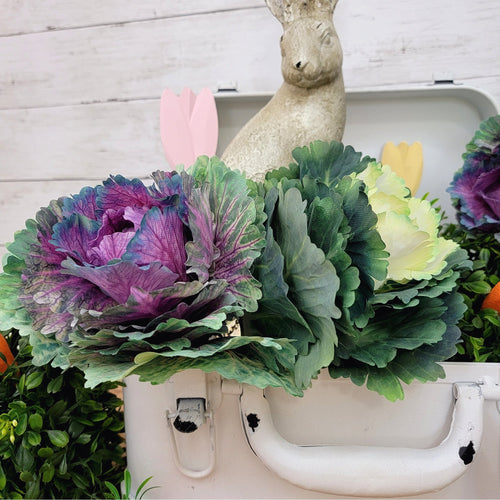 Artificial purple and green cabbage floral picks.