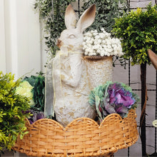 Load image into Gallery viewer, Weathered cottage bunny figurine with a basket of babys breath.
