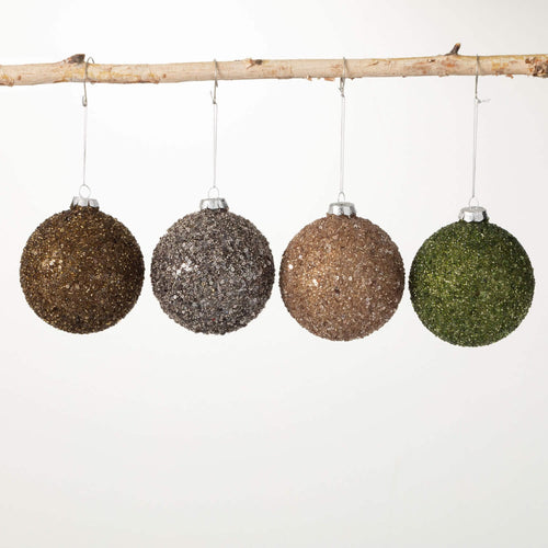 Sequin and glitter encrusted neutral glass ornament set.