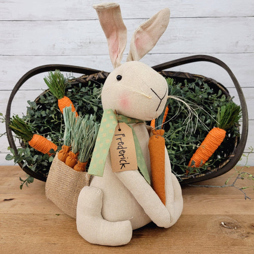 Frederick the plush bunny with burlap carrot bag.