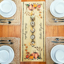 Load image into Gallery viewer, Autumn tablescape with a primitive pumpkin themed table runner and a glass bottle centerpiece.
