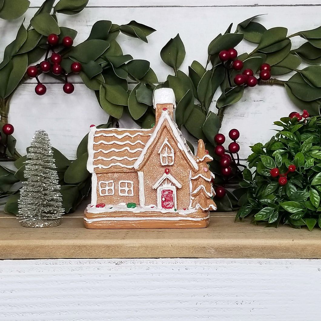 Resin gingerbread cottage house.
