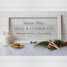 Load image into Gallery viewer, North Pole Milk &amp; Cookie Co Serving Santa&#39;s Favorite Since 1922 glass window sign.
