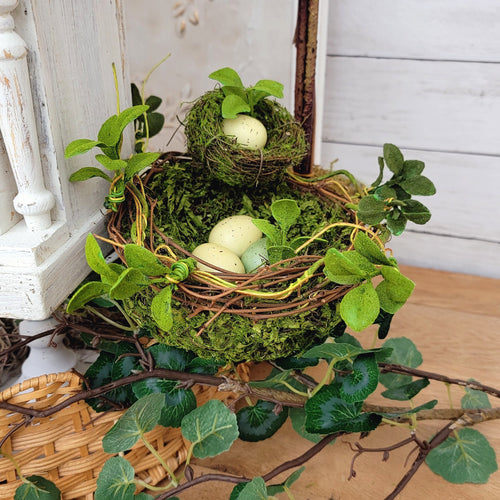 Moss and twig faux double birds nest with eggs. 