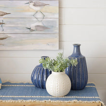 Load image into Gallery viewer, Coastal home console table with blue textured and round white ceramic urchin vase
