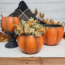 Load image into Gallery viewer, Rustic autumn vignette of 3 orange metal pumpkin containers with a sage green floral orb.
