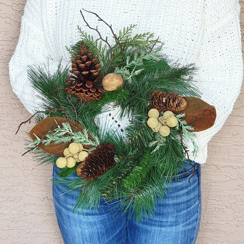 Pine, cone, and nut evergreen neutral accent wreath.