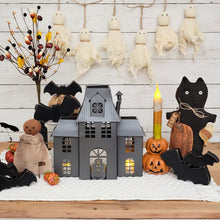 Load image into Gallery viewer, Primitive Halloween vignette with a ghost garland, haunted mansion luminary, bats, and spooky pumpkin girl doll.
