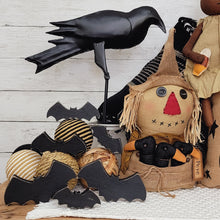 Load image into Gallery viewer, Farmhouse Halloween vignette with wood-bats, metal crow, and primitive scarecrow.
