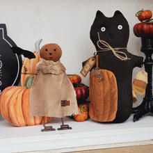 Load image into Gallery viewer, Primitive pumpkin girl ornament displayed with a Trick or Treat black scaredy cat doll.
