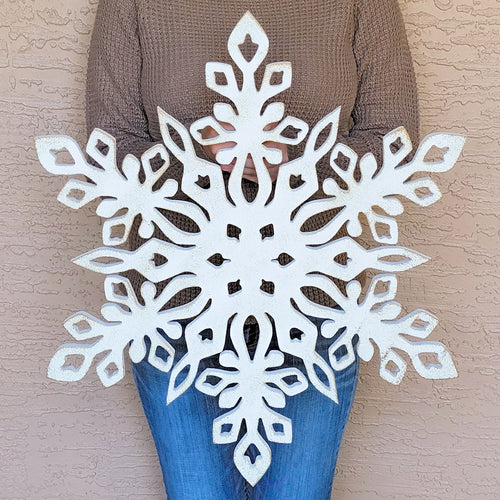 Oversized snowflake shaped cutout winter wall decor