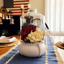 Load image into Gallery viewer, Patriotic hydrangea centerpiece in a glass and ceramic terrarium with a denim table runner.
