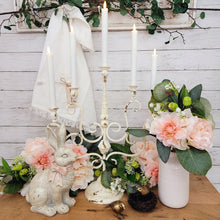 Load image into Gallery viewer, Vintage style chippy white metal candelabra Easter centerpiece.

