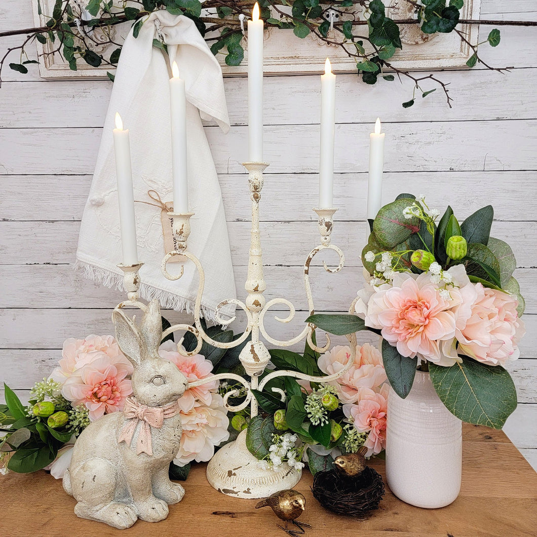 Vintage style chippy white metal candelabra Easter centerpiece.