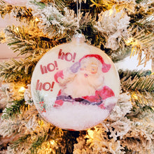 Load image into Gallery viewer, Ho, ho, ho! Class Santa, snow filled round glass ornament.
