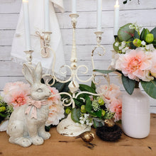 Load image into Gallery viewer, Vintage style candelabra and Easter bunny spring vignette.
