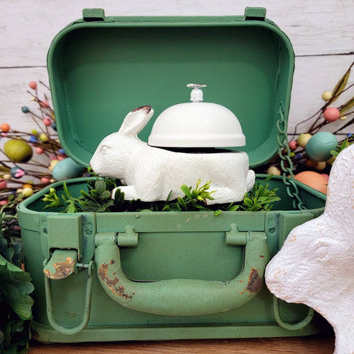 Green metal vintage suitcase box with a white rabbit desk bell.