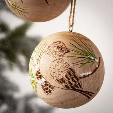 Natural wood sphere ornament with etched and painted winter birds.