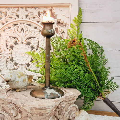 Lush green cinnamon fern floral pick with an orante pedestal lamp riser
