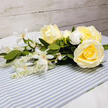 Load image into Gallery viewer, Artificial Cream Roses with Assorted White Flowers and Foliage floral pick laying on a blue and white stripe table runner
