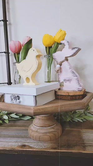 Video of an Entryway Easter Table Display with Metal Garden Gate Wall Decor Pink and Lavender Floral Wreath Wood Cutout tulips Distressed Rustic Bunny