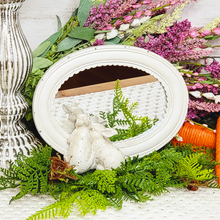 Load image into Gallery viewer, Tabletop cottage bunnies peeking in a mirror set atop a lush green cinnamon fern floral pick
