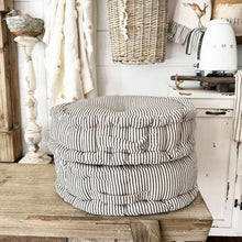 Load image into Gallery viewer, Ticking stripe farmhouse round floor cushion set on a rustic table.

