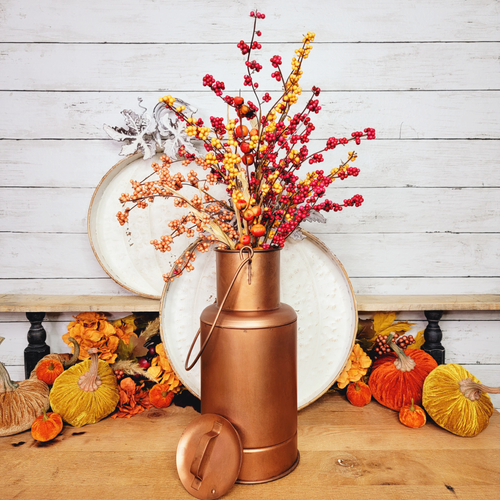 Artificial Autumn berry floral arrangement in an antique inspired metal copper vase.